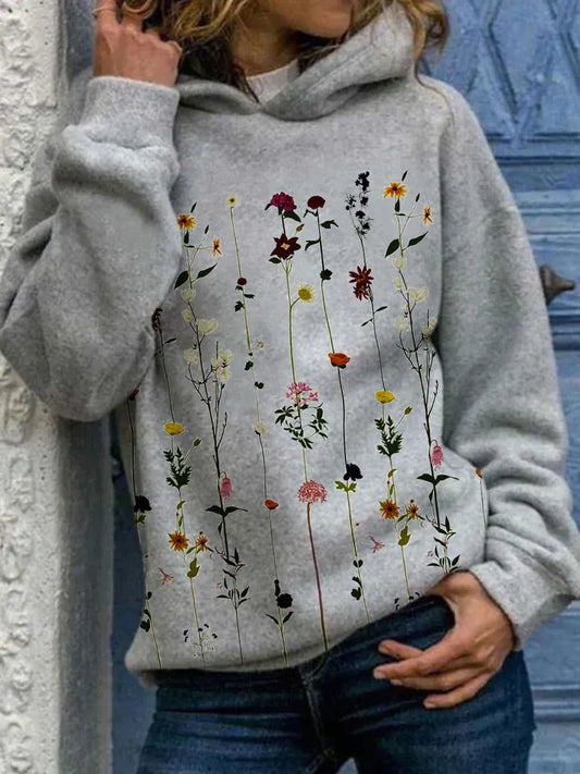 MALOU - Sweat à Capuche Fleuri Grande Taille Découvrez notre sweat MALOU, une création mode grande taille qui allie confort décontracté et élégance française. Ce sweat à capuche grande taille offre un design fleuri et tendance, idéal pour les femmes qui s