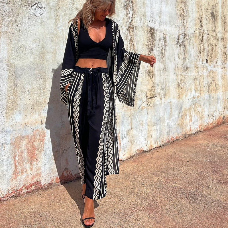 NELE - Pantalon à Motifs Géométriques Grande Taille Découvrez notre pantalon NELE, une création mode grande taille qui marie motifs géométriques audacieux et élégance française. Ce pantalon grande taille offre une silhouette moderne et artistique, créé po