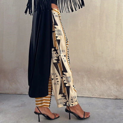 NELE - Pantalon à Motifs Géométriques Grande Taille Découvrez notre pantalon NELE, une création mode grande taille qui marie motifs géométriques audacieux et élégance française. Ce pantalon grande taille offre une silhouette moderne et artistique, créé po